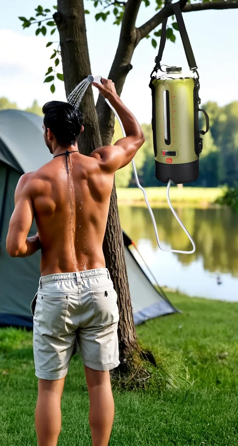 A man rinsing off under the HappyPo camping shower hung from a tree by a lake